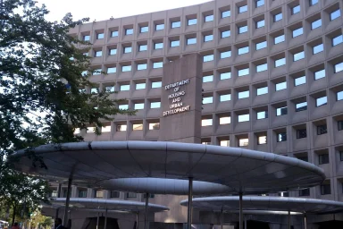 Exterior of the Department of Housing and Urban Development building with canopy entrances