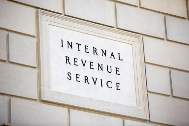 Internal Revenue Service sign engraved on a stone government building facade