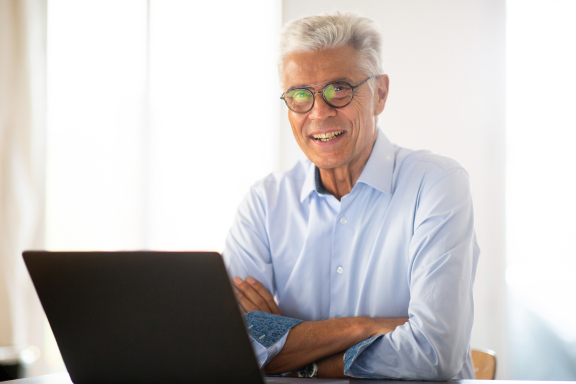 Man using a laptop at home