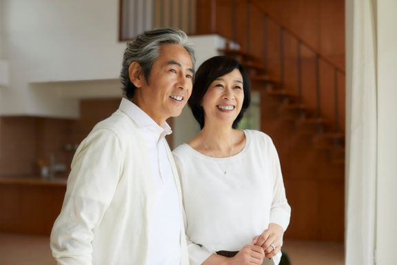 Couple standing together at home